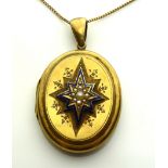 A VICTORIAN YELLOW METAL, SEED PEARL AND ENAMEL LOCKET The satin finish having a cluster of pearls