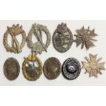 A COLLECTION OF NINE WORLD WAR II GERMAN BADGES Including an E-Boat war badge, a Spanish wound