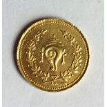 A CONTINENTAL 22CT GOLD COIN Bearing a laurel wreath design to reverse with Sanskrit inscription. (