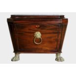 A GEORGIAN MAHOGANY SARCOPHAGUS FORM WINE COOLER Fitted with gilt bronze lion mask loop handle and