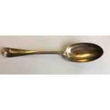 AN EARLY 19TH CENTURY IRISH SILVER SERVING SPOON Fiddle pattern, initialled 'TTA' to rear,