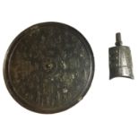 A HEAVY CAST BRONZE CHINESE ARCHAIC FORM MIRROR The relief decoration in the form of symbols and