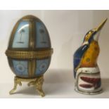 A 20TH CENTURY CONTINENTAL PORCELAIN EGG Having hand painted pale blue panels held within gilt