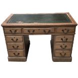 A VICTORIAN MAHOGANY TWIN PEDESTAL DESK With tooled leather writing surface above an arrangement
