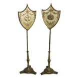 A PAIR OF 19TH CENTURY POLE SCREENS With glazed shield form screens over green painted supports,