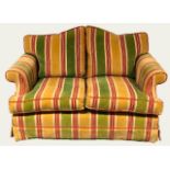 SINCLAIR MELSON LTD, BY APPOINTMENT TO THE QUEEN, A GOOD HUMP BACK SETTEE With over scroll arms,
