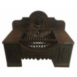 A GEORGIAN CAST IRON FIRE GRATE The shaped back with foliate and scrolling motifs. (h 50cm x w