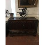 AN 18TH CENTURY MULE CHEST Having four panels above three drawers with brass fittings, raised on