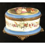 A 19TH CENTURY FRENCH PORCELAIN AND GILT METAL CASKET Decorated with a romantic scene. (21cm x