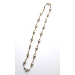 A 9CT GOLD AND PEARL NECKLACE Having a single row of pearls interspersed with gold links. (approx
