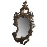 A 19TH CENTURY FRENCH KIDNEY FORM PIER MIRROR The carved gilt frame with scroll and foliate