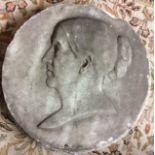 A VICTORIAN MARBLE PORTRAIT ROUNDEL Carved with a profile portrait of a lady with tied back hair. (