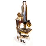 BAUSCH & LOMB, AN EARLY/MID 20TH CENTURY MICROSCOPE In original mahogany fitted case with spare