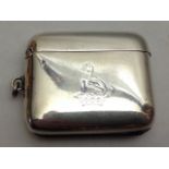 A VICTORIAN SILVER RECTANGULAR VESTA CASE Bearing a family crest of a hound seated upon a coronet,