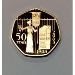 A 22CT GOLD FIFTY PENCE PIECE COMMEMORATIVE PROOF COIN, DATED 2003