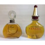 TWO VINTAGE FACTICE SHOP DISPLAY PERFUME BOTTLES To include 'First' by Van Cleef and Arpels,