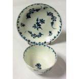 AN 18TH CENTURY WORCESTER PORCELAIN TEA BOWL AND SAUCER Hand painted with underglaze blue floral