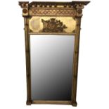 A 19TH CENTURY PIER MIRROR The gilt frame with Lion mask motifs and military emblems. (h 98cm x w