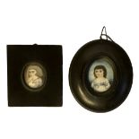 TWO 19TH CENTURY NAIVE SCHOOL OVAL MINIATURE PORTRAITS ON IVORY In ebonised frames.