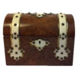A VICTORIAN WALNUT AND IVORY TEA CADDY The dome top having applied ivory and brass straps and