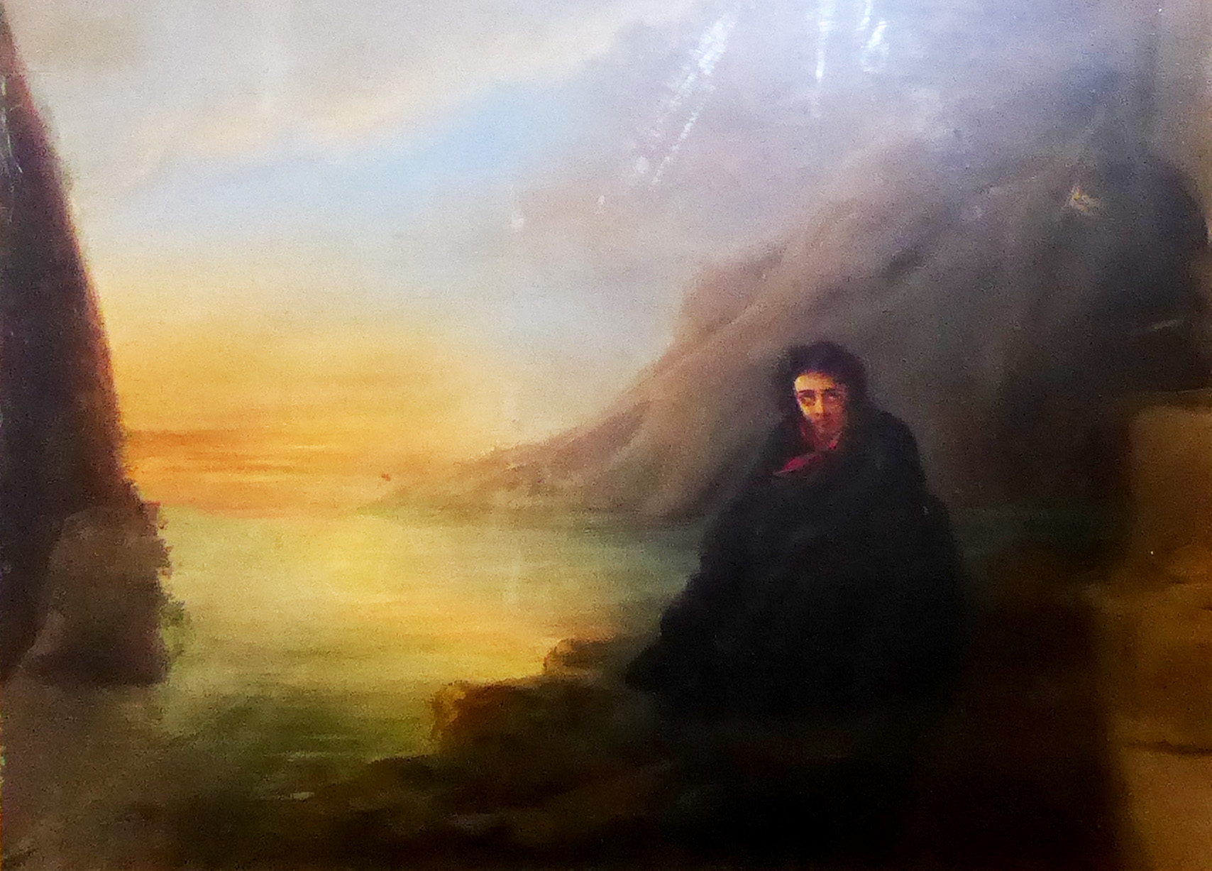 A 19TH CENTURY OIL ON CANVAS French landscape, with a forlorn seated figure in foreground and held