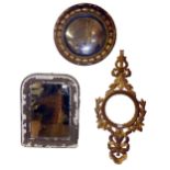 A 19TH CENTURY CONVEX MIRROR Contained in a gilt frame with spherical motifs, sold together with a