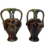 A LARGE PAIR OF 19TH CENTURY PORTUGUESE MAJOLICA GROTESQUE VASES The handles formed as serpents,