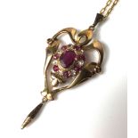 AN EARLY 20TH CENTURY ART NOUVEAU STYLE 15CT GOLD, RUBY AND DIAMOND PENDANT With a cabochon cut ruby