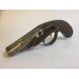 A 19TH CENTURY DOUBLE BARREL PERCUSSION CAP PISTOL With cross hatched walnut grip and incised