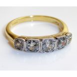 AN 18CT GOLD AND DIAMOND FIVE STONE RING Having a row of graduating round cut diamonds, held in a