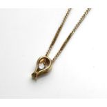 AN 18CT GOLD AND DIAMOND PENDANT NECKLACE Having a single round cut diamond held in a balloon form