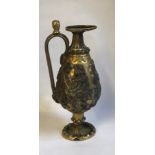 A 19TH CENTURY CONTINENTAL SILVER PLATE AND BRASS EWER Decorated with relief scenes of Medieval