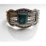 BUTLER & WILSON, A VINTAGE SILVER AND TURQUOISE CUFF BANGLE Having a cabochon cut stone set in a