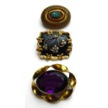 A COLLECTION OF THREE VICTORIAN YELLOW METAL BROOCHES Comprising a mourning brooch set with seed