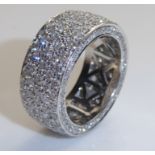 AN 18CT WHITE GOLD AND DIAMOND FULL ETERNITY RING Having five rows of round cut diamonds flanked