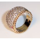 A VINTAGE 14CT GOLD AND DIAMOND CLUSTER RING Having five rows of round cut diamonds and the shank