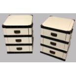 A PAIR OF THREE DRAWER CHEST With heavy strap work bindings and brass handles, in a cream finish. (