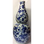 A CHINESE BLUE AND WHITE PORCELAIN DOUBLE GOURD VASE Decorated with birds and insects amongst