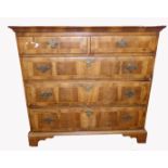 AN EARLY 18TH CENTURY WALNUT CHEST Having an arrangement of two short above three long drawers,