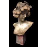 A 19TH CENTURY ALABASTER ART NOUVEAU BUST Of a maiden wearing an entwined leaf headdress, raised