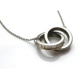 TIFFANY & CO., A SILVER PENDANT AND CHAIN Two consecutive intertwined rings held on a fine link