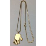 A VINTAGE 9CT GOLD PENDANT AND NECKLACE Hand design with enlarged thumb, marked 'V & Co.', suspended