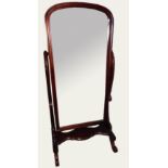 A 19TH CENTURY DESIGN MAHOGANY CHEVAL MIRROR With bevelled plate glass on a scrolling stand.