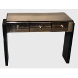 A STYLISH PEACH AND BLACK GLASS SIDE TABLE With three drawers. (100cm x 45cm x 73cm)