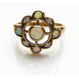 A VINTAGE 9CT GOLD, OPAL AND DIAMOND RING Having a single cabochon cut opal held in a pierced