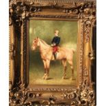 A 20TH CENTURY OIL ON CANVAS Portrait of a young officer on horseback, gilt framed. (57cm x 65cm)