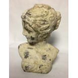 A PAINTED TERRACOTTA BUST OF A CLASSICAL MAIDEN With her hair tied back. (h 29cm)