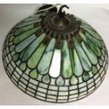 A 20TH CENTURY TIFFANY STYLE GLASS LIGHT SHADE Having a bronze finial set with coloured glass