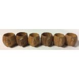 ROBERT THOMPSON, A SET OF FOUR EARLY 20TH CENTURY OAK 'MOUSEMAN' OCTAGONAL SERVIETTE RINGS Each