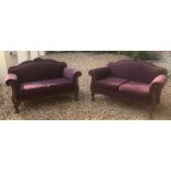 A PAIR OF EARLY 20TH CENTURY CONTINENTAL TWO SEAT SETTEES The beech wood frames applied with